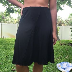 Knee-length black skirt